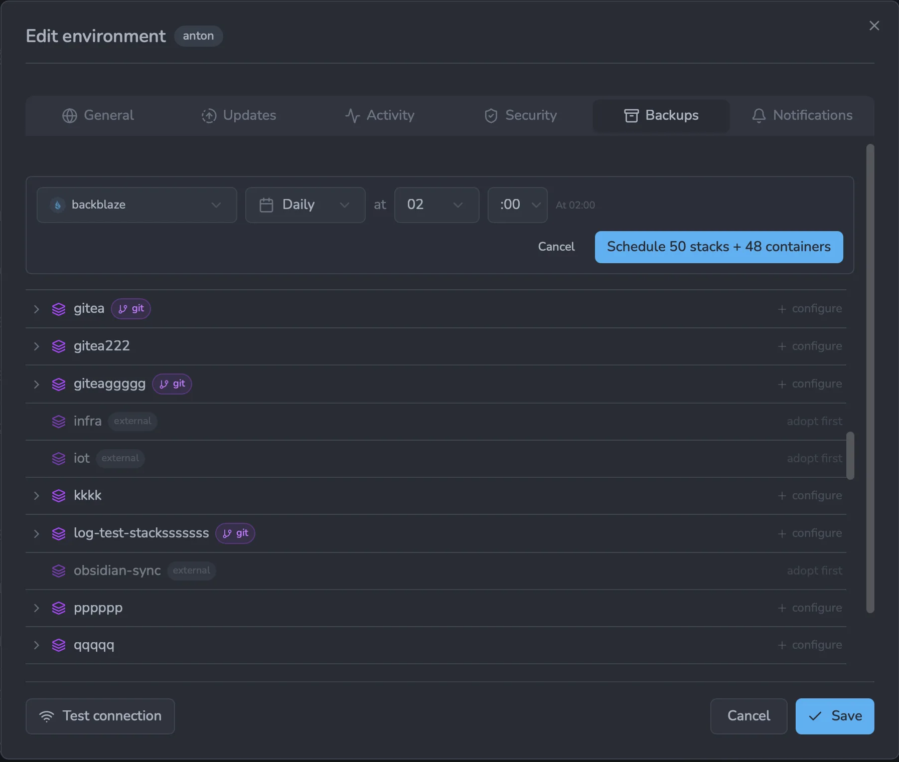Edit environment → Backups tab: a batch-create form (destination + schedule) with a &ldquo;Schedule 50 stacks + 48 containers&rdquo; button, above a list of the environment's stacks — git-managed stacks marked with a git badge, external stacks marked external with an &ldquo;adopt first&rdquo; hint, and a per-row configure action.